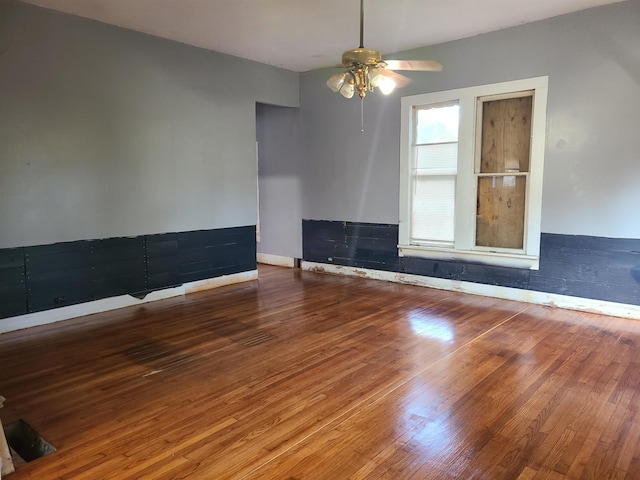 unfurnished room featuring ceiling fan and wood-type flooring