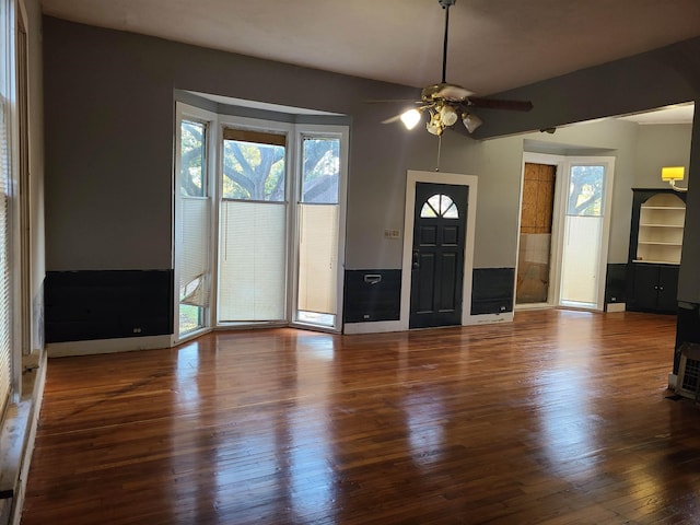 foyer featuring ceiling fan and dark hardwood / wood-style flooring