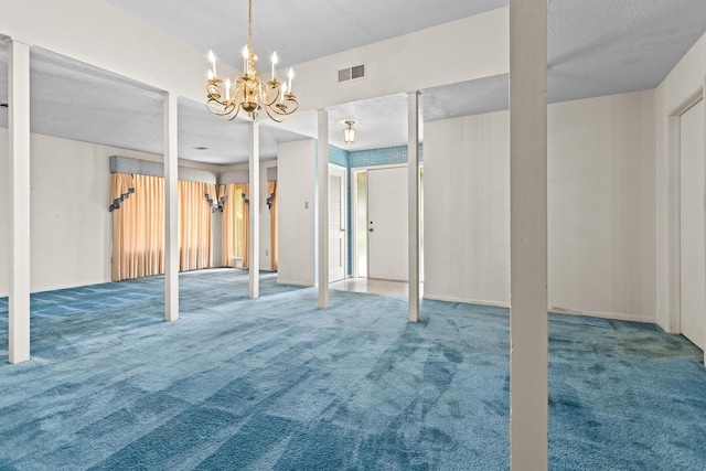 470 Junker Rd, Beaumont, TX 77707 - basement featuring carpet flooring, a chandelier, and a textured ceiling