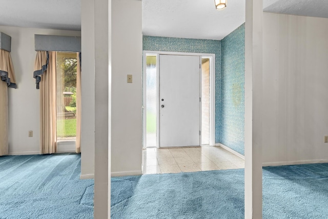 470 Junker Rd, Beaumont, TX 77707 - carpeted entrance foyer featuring wallpapered walls and baseboards