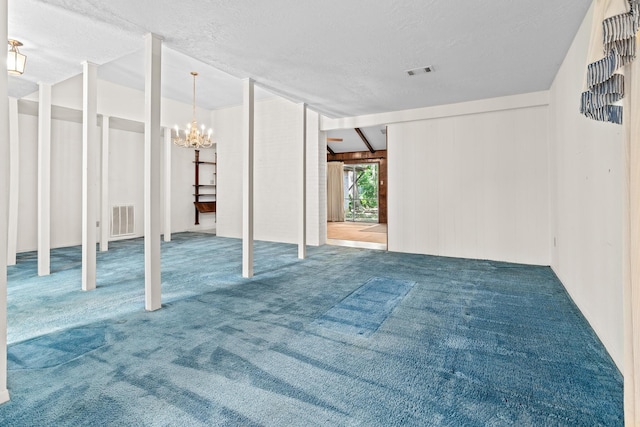 470 Junker Rd, Beaumont, TX 77707 - basement featuring a chandelier, carpet flooring, and a textured ceiling