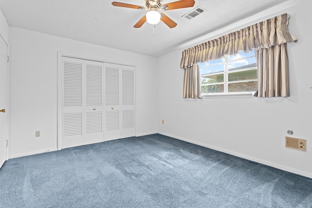 470 Junker Rd, Beaumont, TX 77707 - unfurnished bedroom with carpet flooring, a closet, a textured ceiling, baseboards, and a ceiling fan