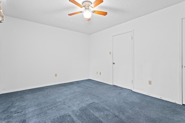 470 Junker Rd, Beaumont, TX 77707 - spare room with dark colored carpet, a ceiling fan, baseboards, and a textured ceiling