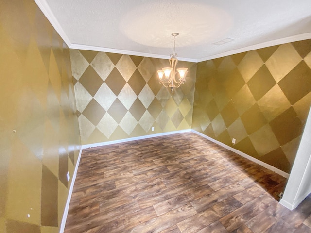 unfurnished dining area with hardwood / wood-style flooring, ornamental molding, and a notable chandelier