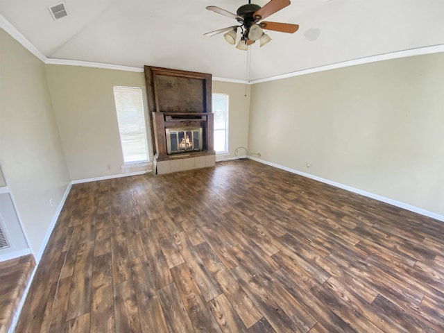 unfurnished living room featuring lofted ceiling, a tiled fireplace, ornamental molding, and dark hardwood / wood-style floors