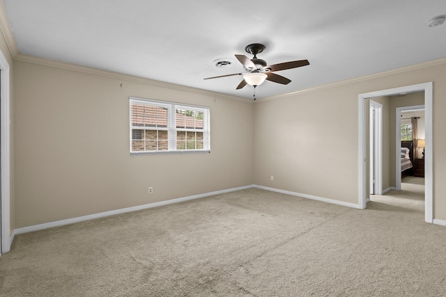 2040 Chevy Chase Ln, Beaumont, TX 77706 - spare room featuring carpet floors, a ceiling fan, healthy amount of natural light, crown molding, and baseboards