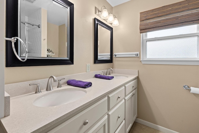 2040 Chevy Chase Ln, Beaumont, TX 77706 - bathroom featuring double vanity and baseboards