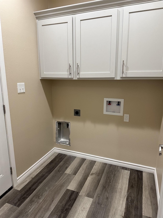 washroom with washer hookup, dark wood-type flooring, cabinets, and hookup for an electric dryer