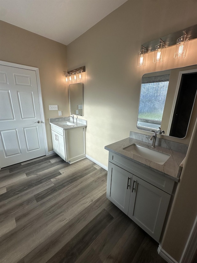 bathroom featuring vanity and hardwood / wood-style flooring