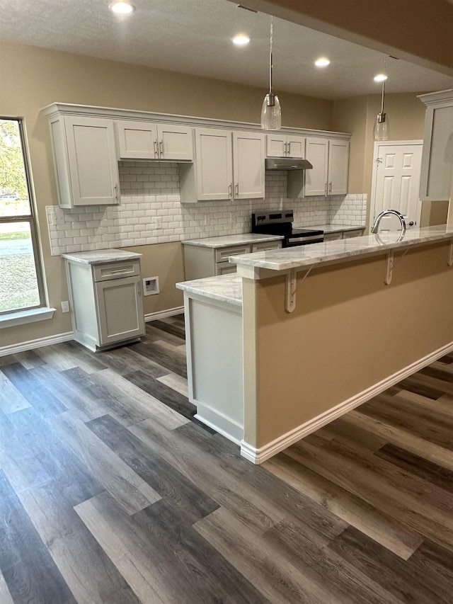 kitchen with electric stove, white cabinets, and dark wood-type flooring