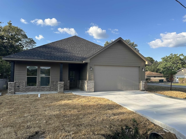 view of front of property with a garage and a front yard