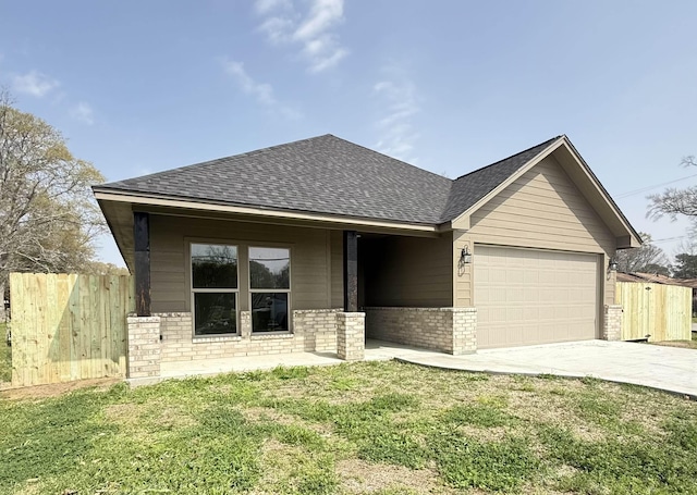 view of front of house featuring brick siding, fence, concrete driveway, roof with shingles, and a garage