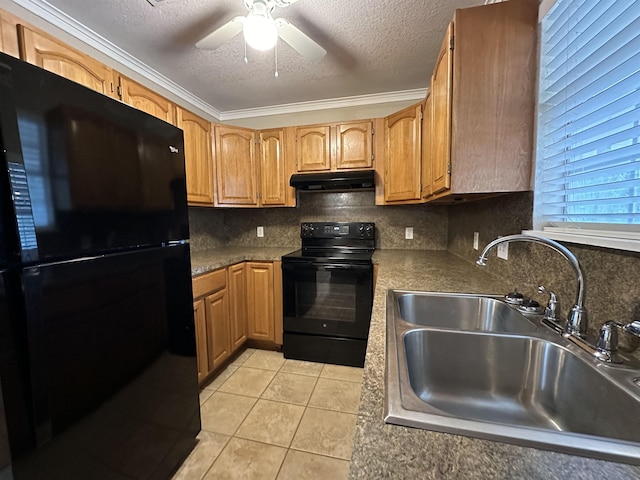 kitchen featuring tasteful backsplash, a textured ceiling, sink, black appliances, and light tile patterned floors