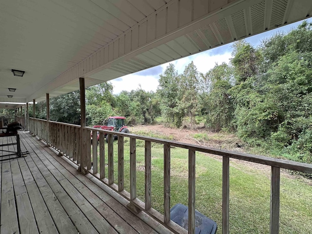 wooden deck with a yard