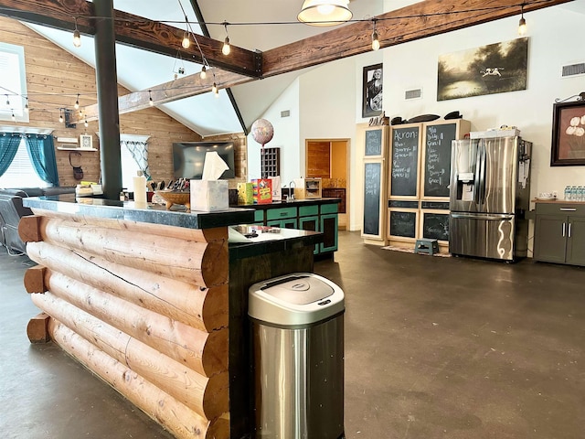 bar featuring wood walls, high vaulted ceiling, sink, stainless steel fridge, and beam ceiling