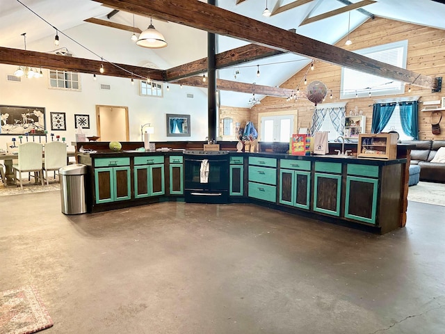 interior space featuring wood walls, concrete flooring, sink, and high vaulted ceiling