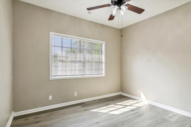 unfurnished room with light wood-type flooring