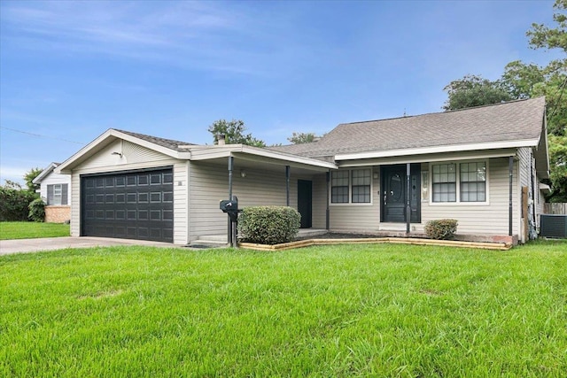 ranch-style home with cooling unit, a garage, and a front lawn