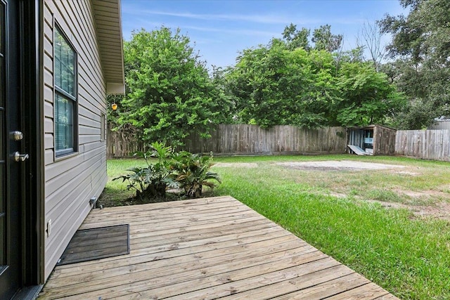 wooden deck with a lawn