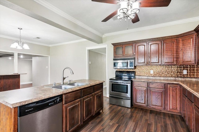 kitchen with backsplash, a center island with sink, crown molding, sink, and appliances with stainless steel finishes