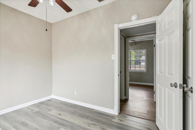 unfurnished room featuring ceiling fan and light hardwood / wood-style floors