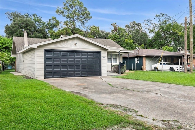 ranch-style home with a garage and a front lawn