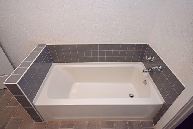 bathroom featuring a tub to relax in