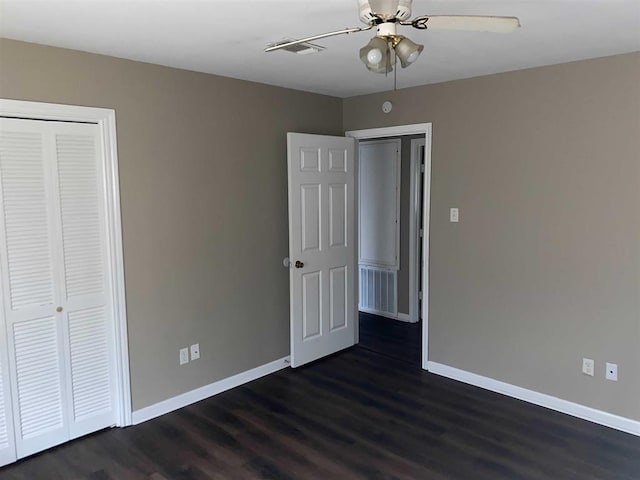 9305 Gardner St, Beaumont, TX 77707 - unfurnished bedroom with dark wood-style flooring, a closet, and a ceiling fan