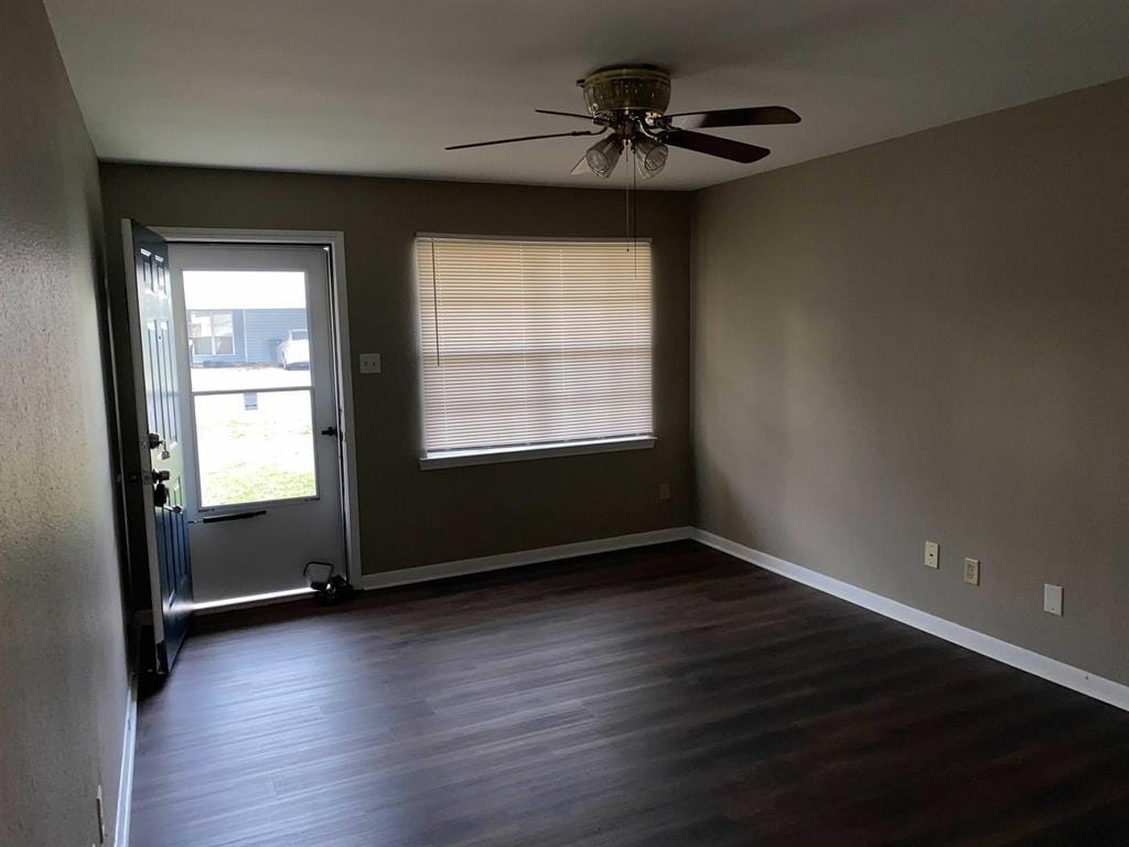 9305 Gardner St, Beaumont, TX 77707 - entryway with dark wood-type flooring and ceiling fan