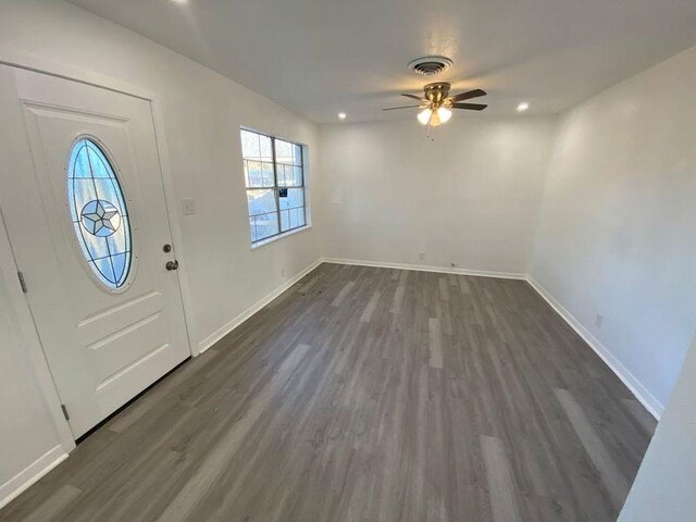 entryway with dark hardwood / wood-style floors and ceiling fan