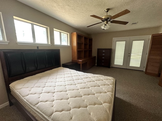 carpeted bedroom featuring a ceiling fan, visible vents, french doors, a textured ceiling, and access to outside