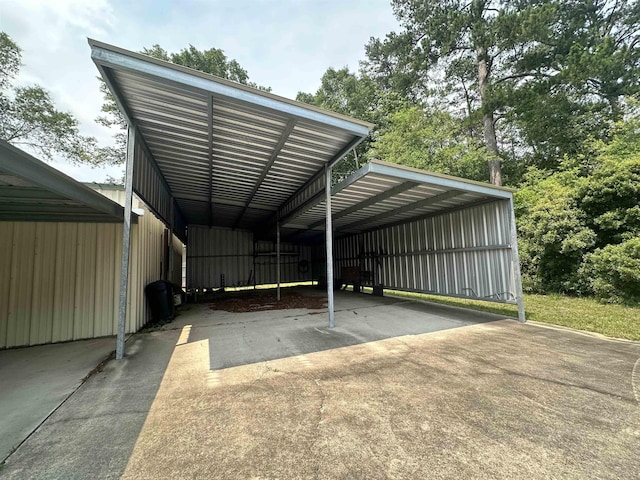 view of vehicle parking featuring a carport and concrete driveway