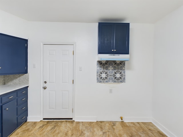 laundry area with cabinets