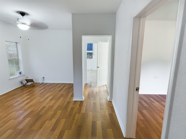 corridor with dark hardwood / wood-style floors