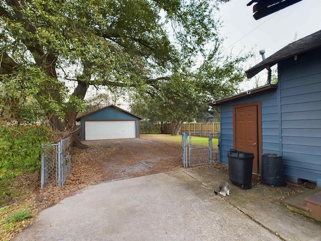 exterior space featuring an outbuilding and a garage