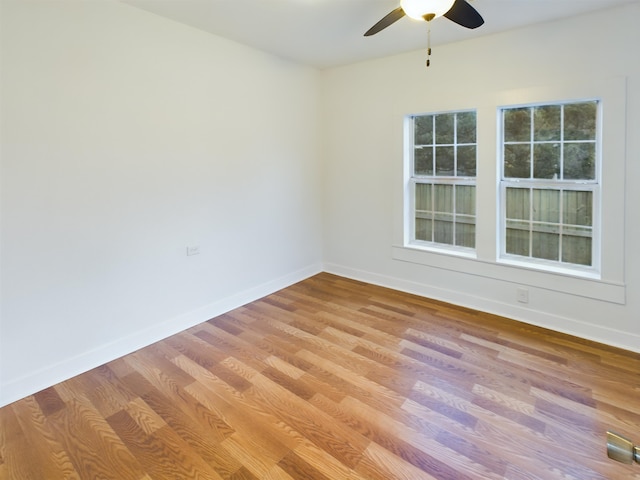 spare room featuring ceiling fan and light wood-type flooring