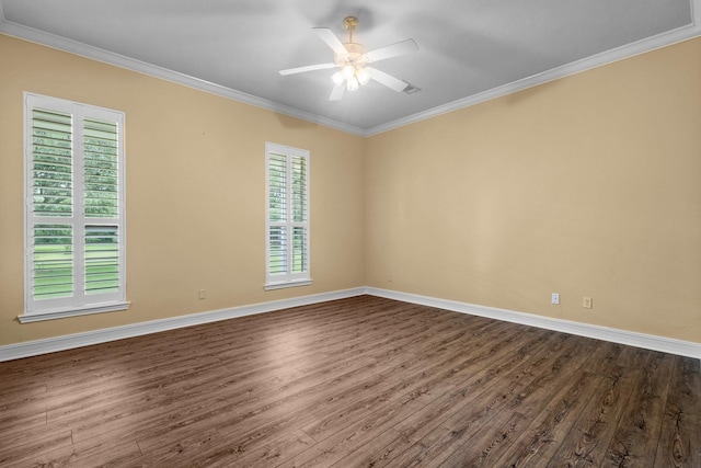 27076 Interstate 10, Winnie, TX 77665 - empty room featuring dark wood finished floors, healthy amount of natural light, crown molding, and baseboards