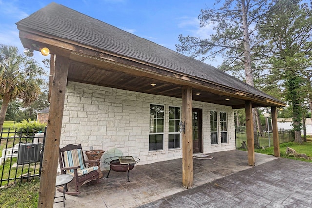 27076 Interstate 10, Winnie, TX 77665 - view of patio featuring an outdoor fire pit