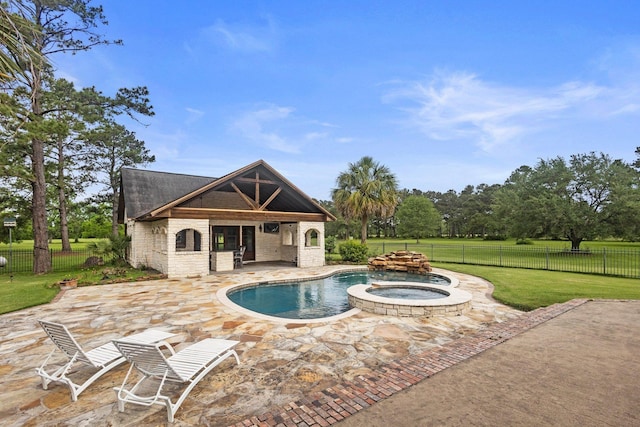 27076 Interstate 10, Winnie, TX 77665 - view of swimming pool featuring a patio area, an exterior structure, an outdoor structure, and a pool with connected hot tub
