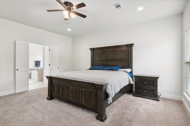 bedroom featuring visible vents, light carpet, recessed lighting, connected bathroom, and baseboards