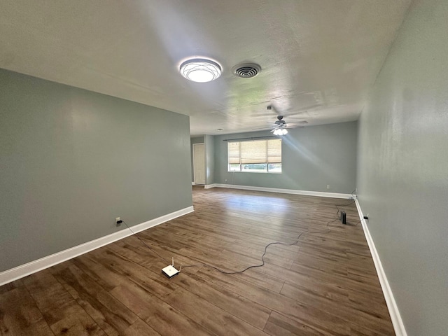 unfurnished room featuring hardwood / wood-style flooring and ceiling fan