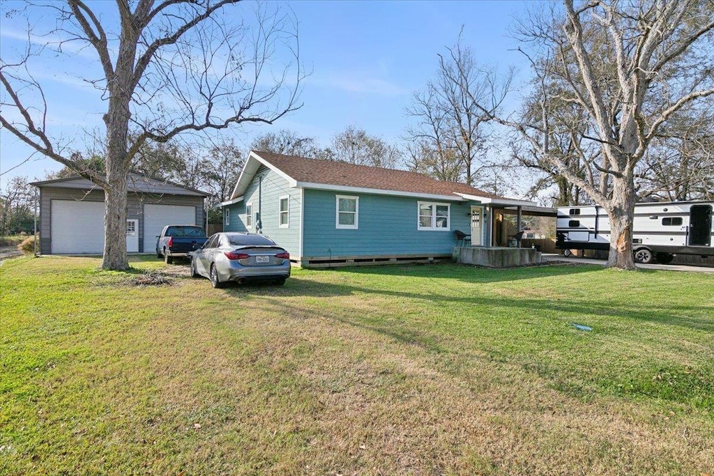 exterior space with a front lawn and a garage