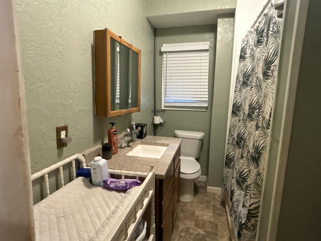 bathroom with vanity and toilet