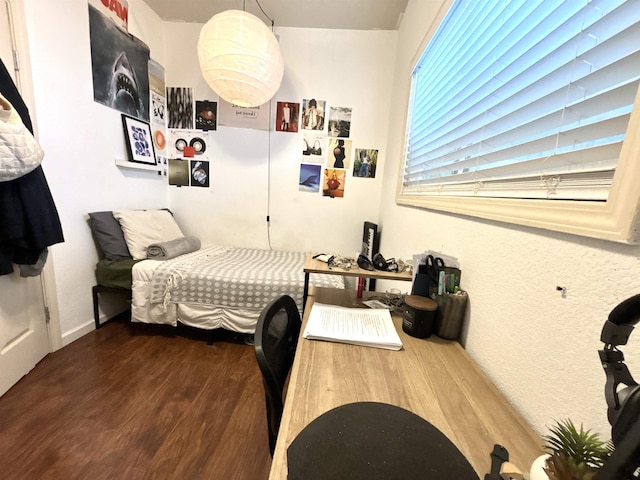 bedroom featuring dark hardwood / wood-style floors