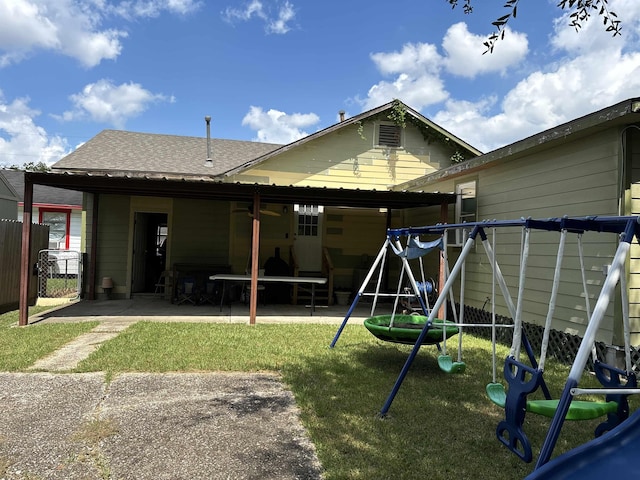 view of playground with a yard