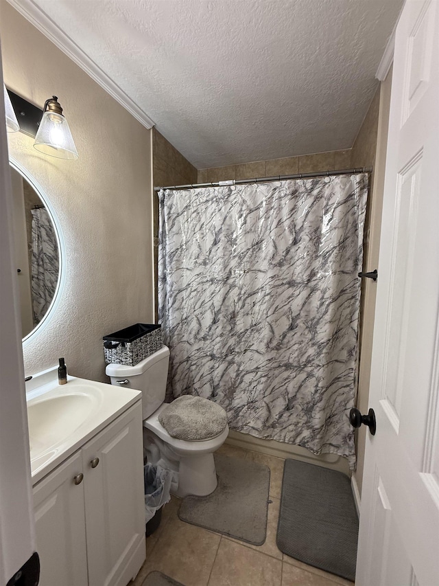 9325 Bamboo Ln, Beaumont, TX 77708 - bathroom featuring a textured ceiling, vanity, tile patterned floors, and a shower with shower curtain