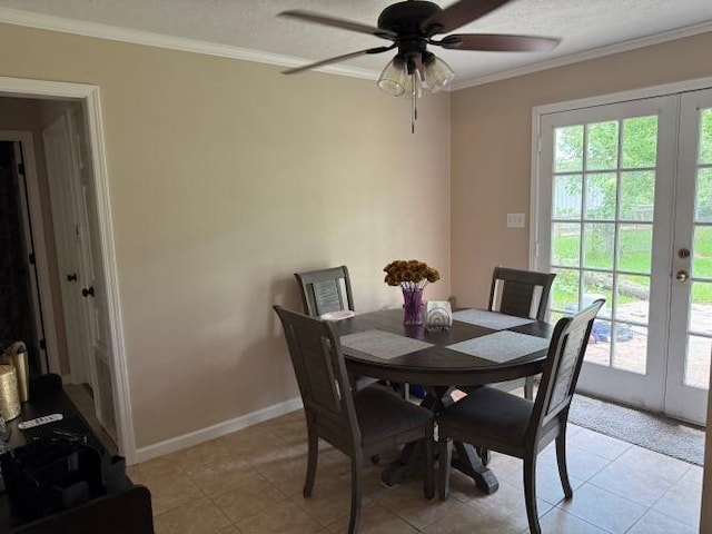 9325 Bamboo Ln, Beaumont, TX 77708 - dining area featuring crown molding, a ceiling fan, light tile patterned floors, and french doors