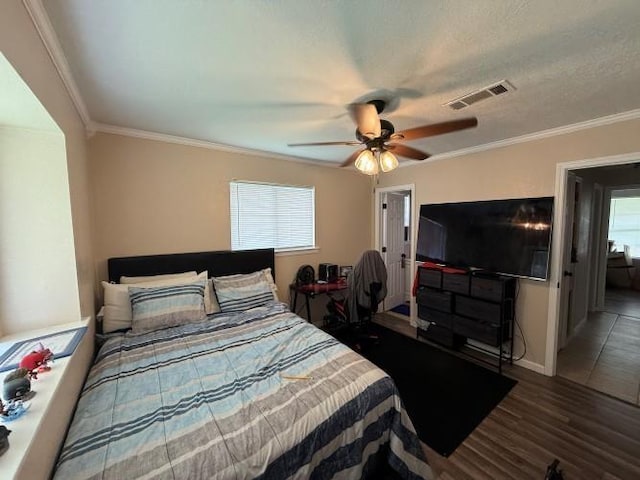 9325 Bamboo Ln, Beaumont, TX 77708 - bedroom with wood finished floors, crown molding, and ceiling fan