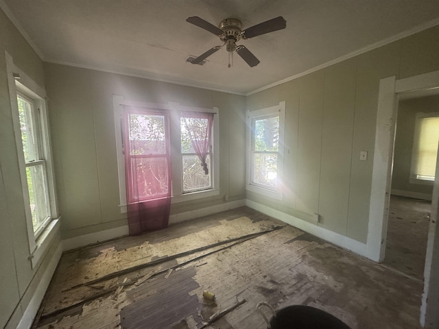 1598 Euclid St, Beaumont, TX 77705 - spare room with healthy amount of natural light, crown molding, a ceiling fan, and baseboards