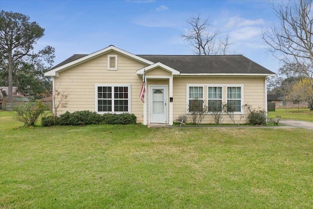 ranch-style home featuring a front yard